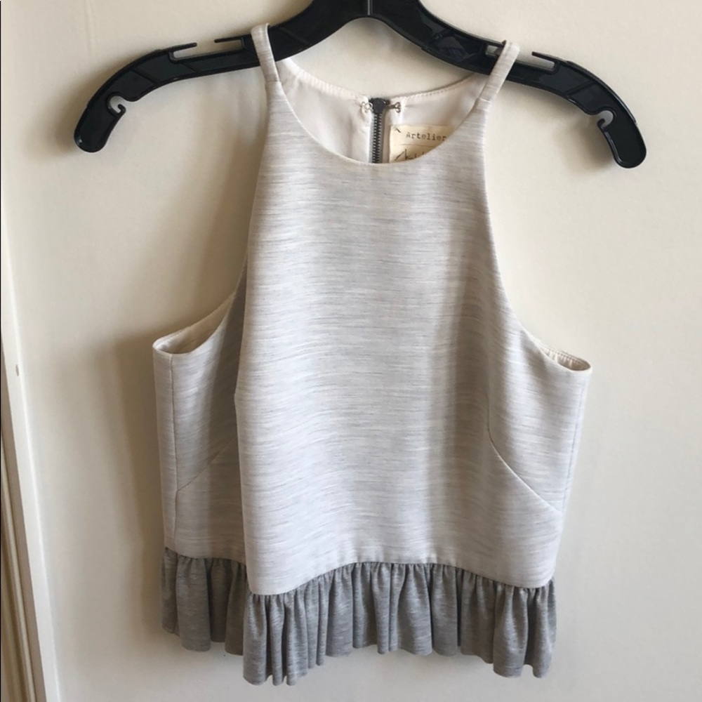 Grey Razorback top with ruffle. Back zipper